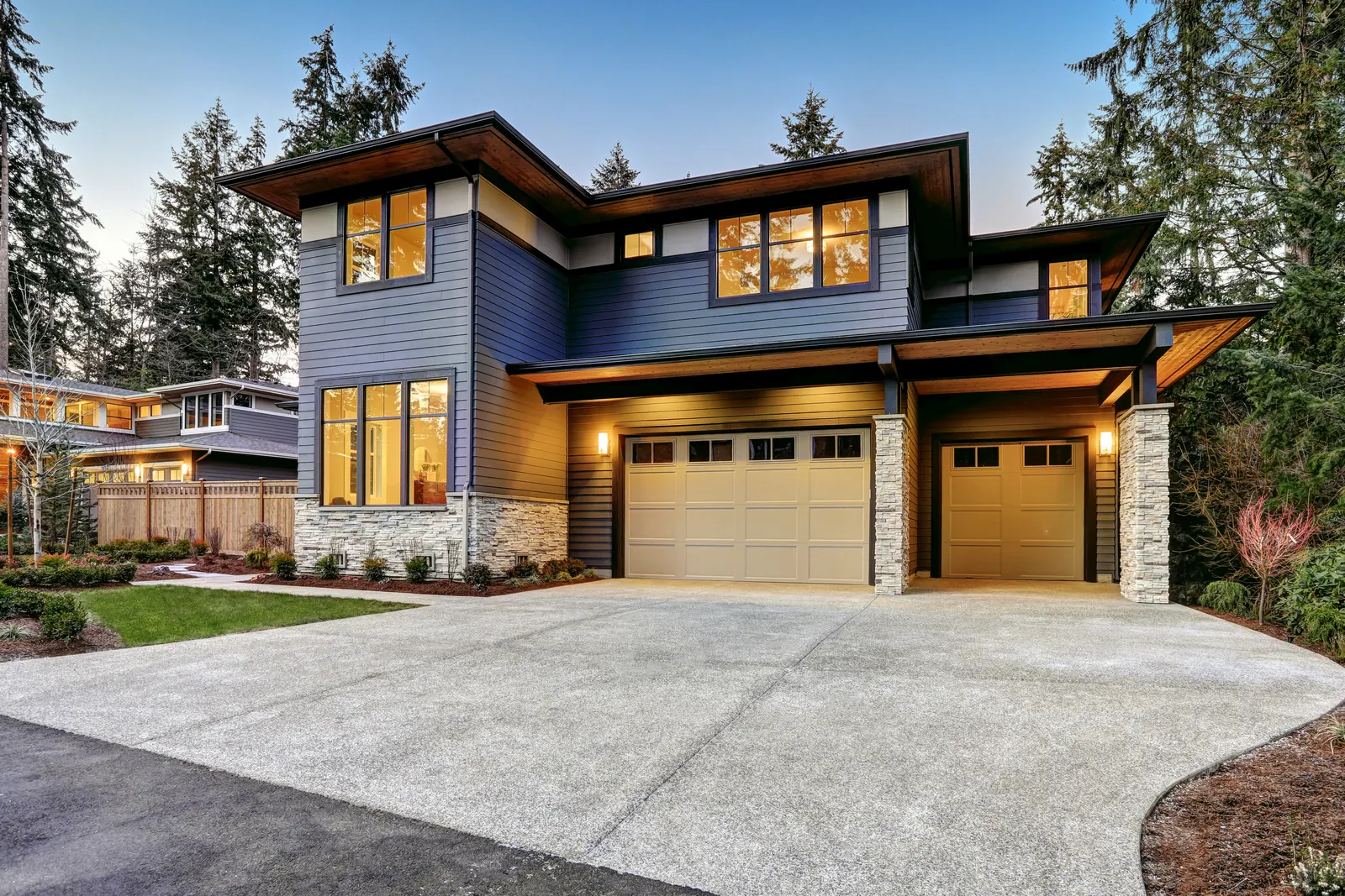 Contemporary luxury residence in Southwest Washington framed by mature evergreens